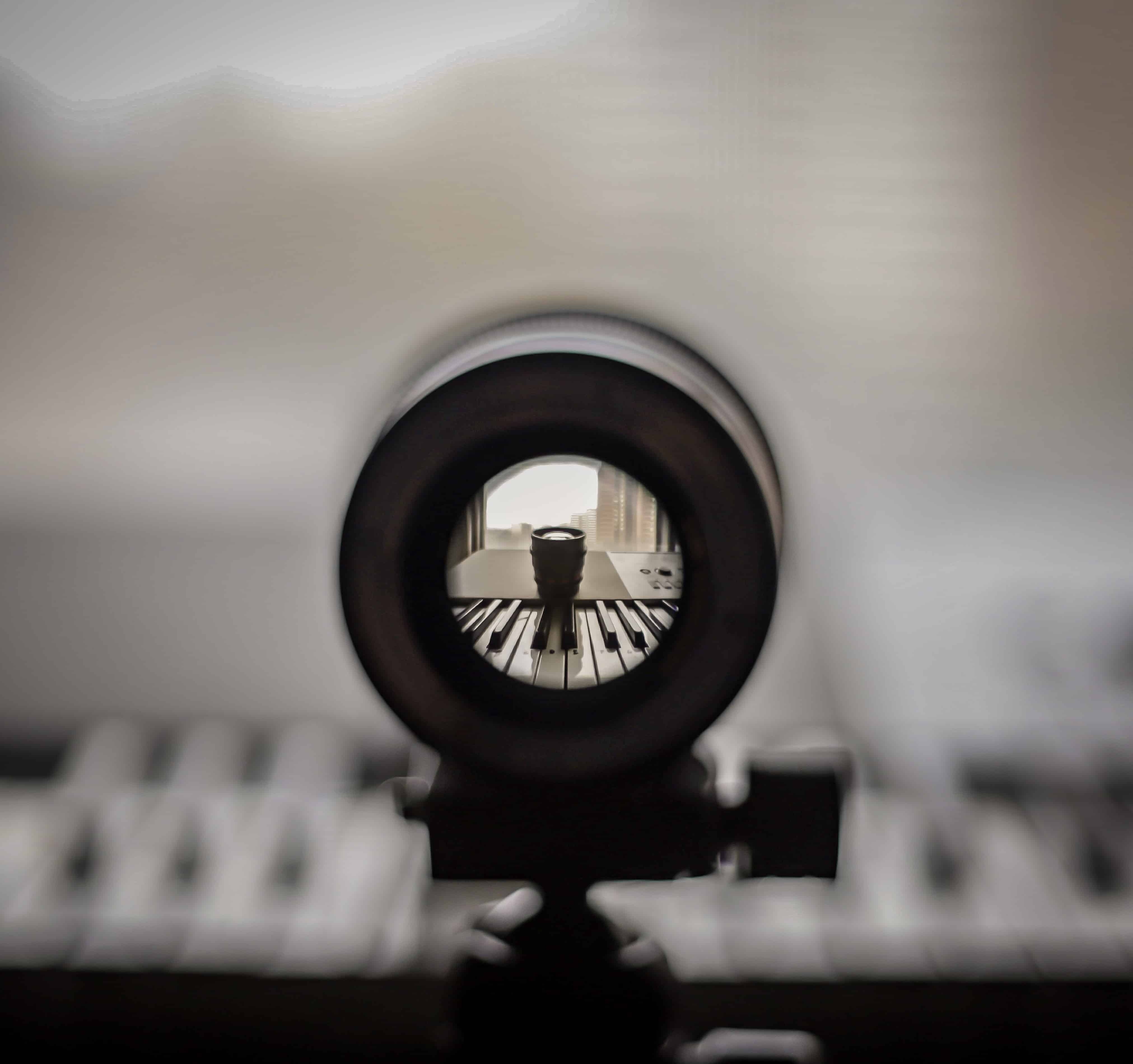 View of a lens looking at a piano.